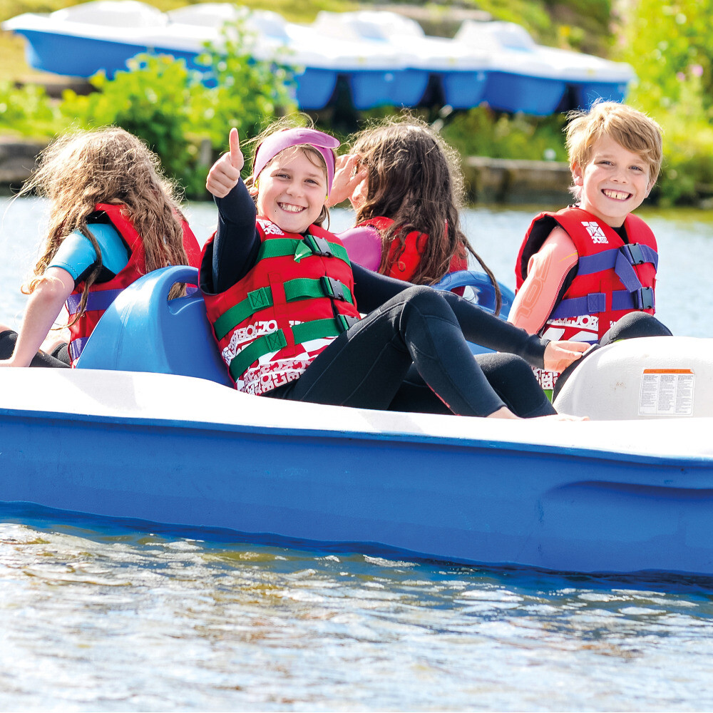 children having fun in a pedalo