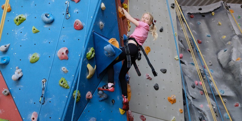 Girl climbing at Aztec Adventure Evesham