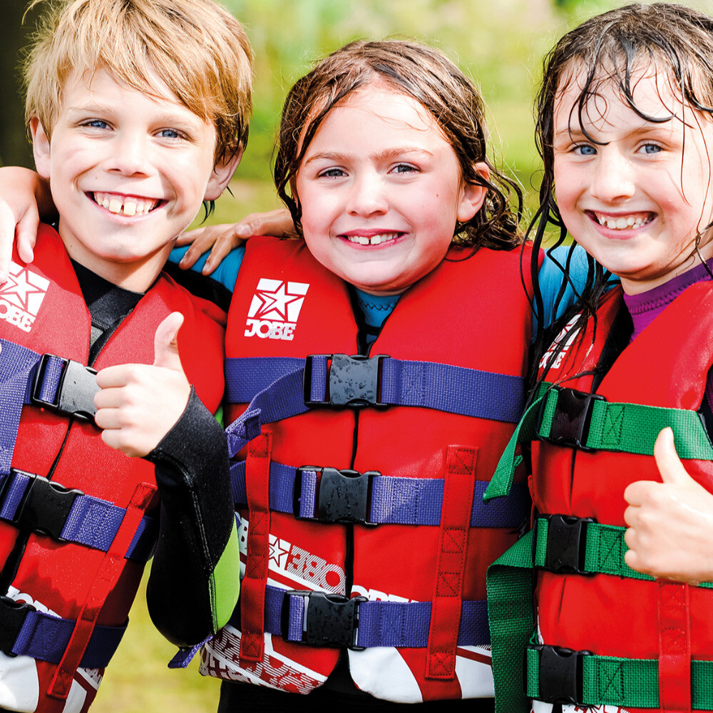 Aztec Adventure three children thumbs up wearing lifejackets