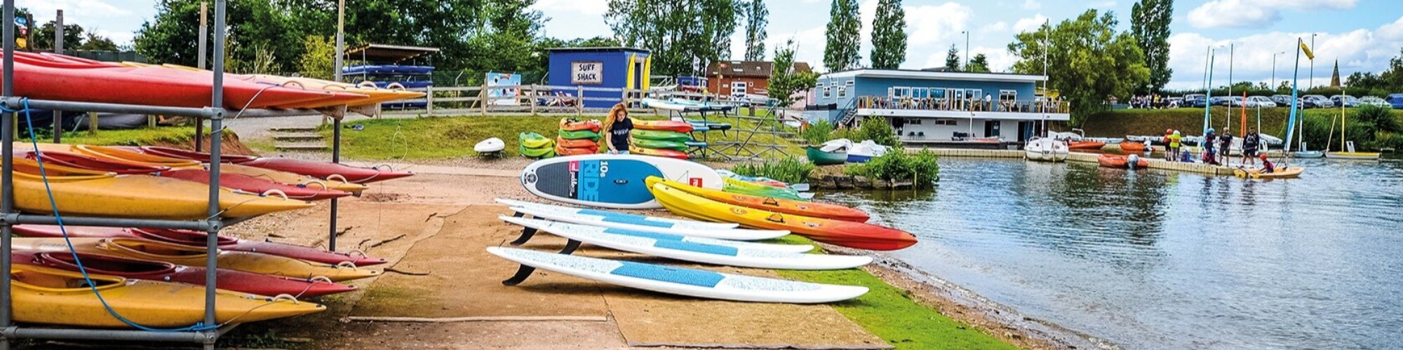 Woman organising water sports equipment